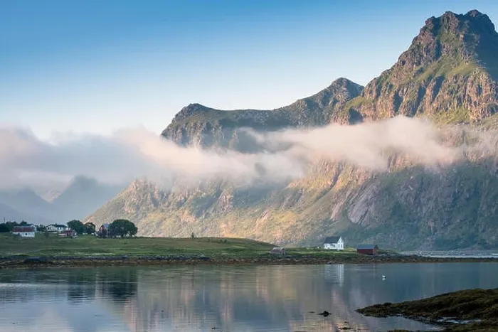 Framed Print : Scenic view with idyllic house and mountains at summer evening in Lofoten, Norway Framed Print : Scenic view with idyllic house and mountains at summer evening in Lofoten, Norway