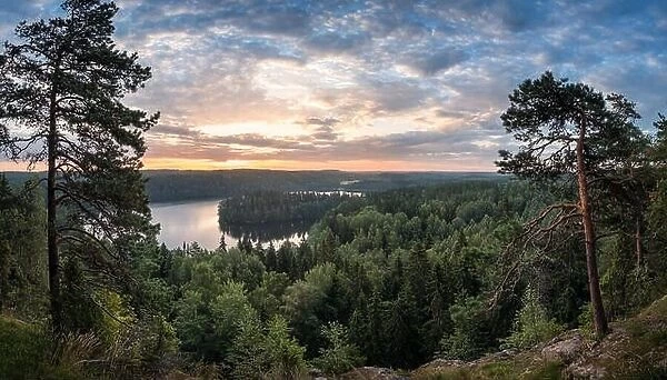 Scenic view with lake and sunset at summer morning in National Park Aulanko, Hämeenlinna, Finland