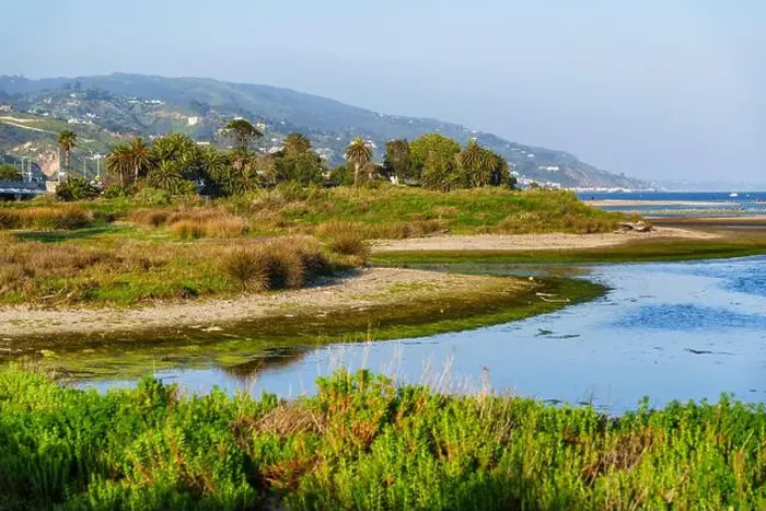 Framed Print : Scenic view of Malibu Lagoon with lush vegetation and mountains in background. California landscape Framed Print : Scenic view of Malibu Lagoon with lush vegetation and mountains in background. California landscape