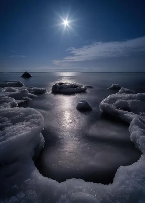Framed Print : Scenic view with moonlight and icy sea at winter night in coastline, Finland Framed Print : Scenic view with moonlight and icy sea at winter night in coastline, Finland