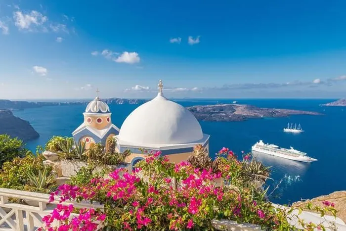 Framed Print : Scenic view of traditional cycladic houses with flowers in foreground, Oia village, Santorini, Greece. Summer travel landscape, sea view. Amazing Framed Print : Scenic view of traditional cycladic houses with flowers in foreground, Oia village, Santorini, Greece. Summer travel landscape, sea view. Amazing