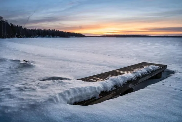 Framed Print : Scenic winter landscape with pier and sunset at evening light in Finland Framed Print : Scenic winter landscape with pier and sunset at evening light in Finland