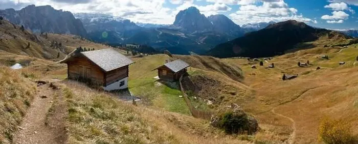 Framed Print : Scenic Wodden Cabins in the Dolomites, European Alps. Shot in summer with green grass and no snow. Gardena Pass, Italy Framed Print : Scenic Wodden Cabins in the Dolomites, European Alps. Shot in summer with green grass and no snow. Gardena Pass, Italy