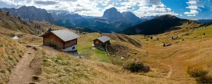 Framed Print : Scenic Wodden Cabins in the Dolomites, European Alps. Shot in summer with green grass and no snow. Gardena Pass, Italy Framed Print : Scenic Wodden Cabins in the Dolomites, European Alps. Shot in summer with green grass and no snow. Gardena Pass, Italy
