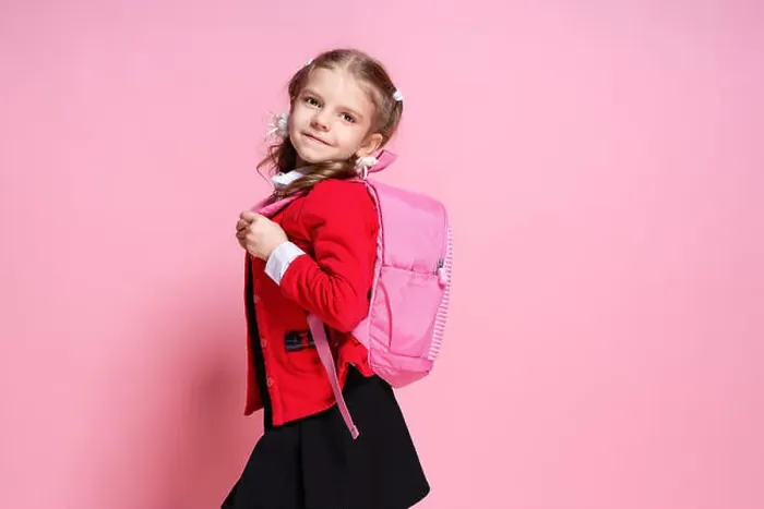 Framed Print : Back to school. Child with schoolbag Framed Print : Back to school. Child with schoolbag