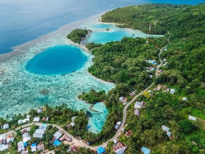 Framed Print : Sea coastline with blue hole in big lagoon and village, scenic landscape in Indonesia. Aerial view Framed Print : Sea coastline with blue hole in big lagoon and village, scenic landscape in Indonesia. Aerial view