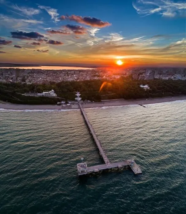 Framed Print : Sea garden at sunset, in the background, downtown Burgas, bulgaria.Вith the bridge Framed Print : Sea garden at sunset, in the background, downtown Burgas, bulgaria.Вith the bridge