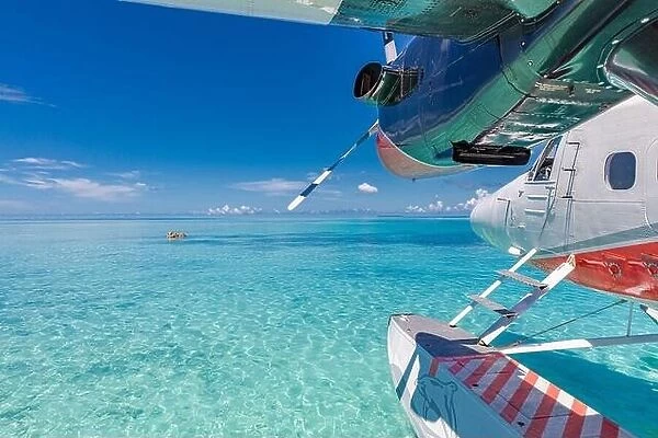 Seaplane at tropical beach resort. Amazing summer travel vacation view. Perfect blue sea view with Maldives islands, transportation, plane, seascape