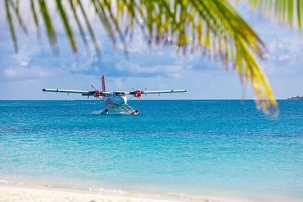 Seaplane at tropical beach resort coast. Luxury summer travel destination with seaplane in Maldives islands. Exotic vacation, exotic transportation