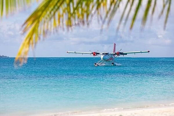 Seaplane at tropical beach resort. Luxury summer travel destination seaplane in Maldives islands. Exotic vacation holiday transportation, Maldives