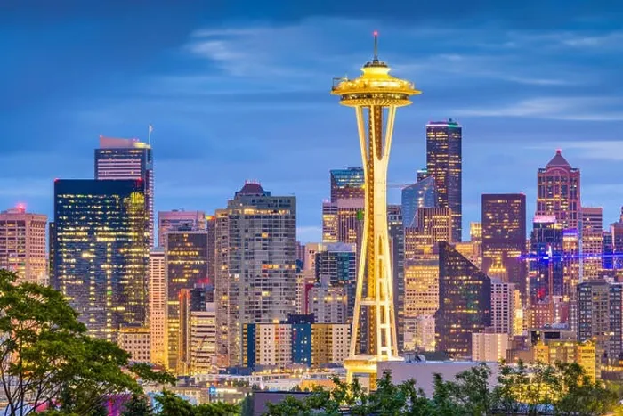 Framed Print : SEATTLE, WASHINGTON - JUNE 26, 2018: The Space Needle towers in front of the downtown Seattle skyline at dusk Framed Print : SEATTLE, WASHINGTON - JUNE 26, 2018: The Space Needle towers in front of the downtown Seattle skyline at dusk