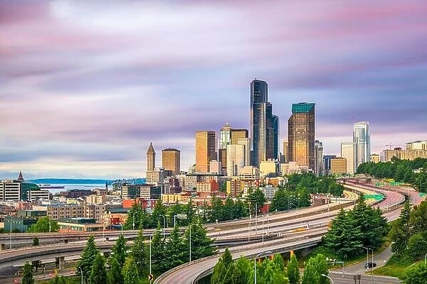 Seattle, Washington, USA downtown city skyline over highways at dusk