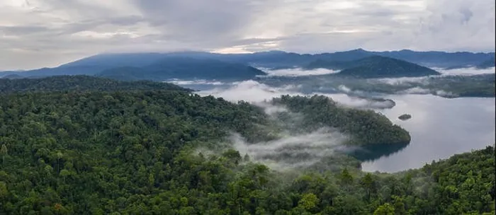 Framed Print : Seen from above, early morning mist drifts over tropical islands in Raja Ampat, Indonesia. This region is known as the heart of the Coral Triangle Framed Print : Seen from above, early morning mist drifts over tropical islands in Raja Ampat, Indonesia. This region is known as the heart of the Coral Triangle
