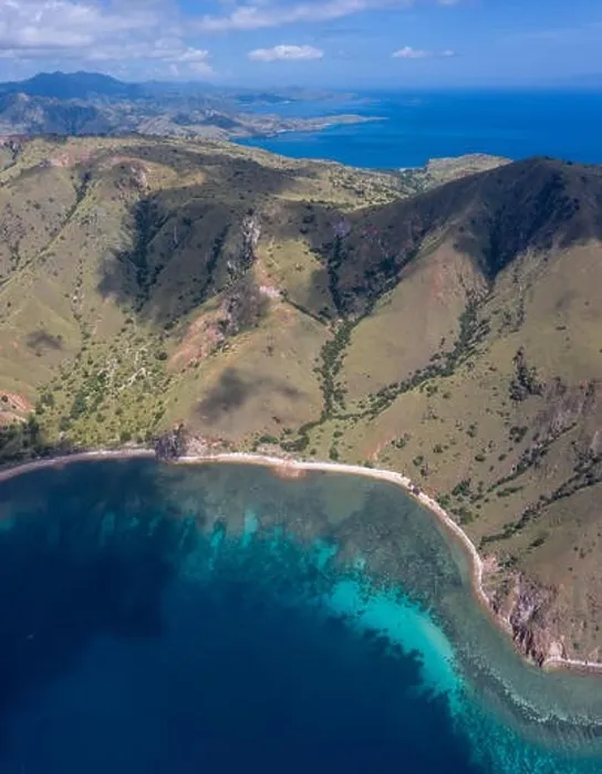 Framed Print : Seen from an aerial view, afternoon light shines on rugged islands in Komodo National Park, Indonesia. This area has high marine biodiversity Framed Print : Seen from an aerial view, afternoon light shines on rugged islands in Komodo National Park, Indonesia. This area has high marine biodiversity