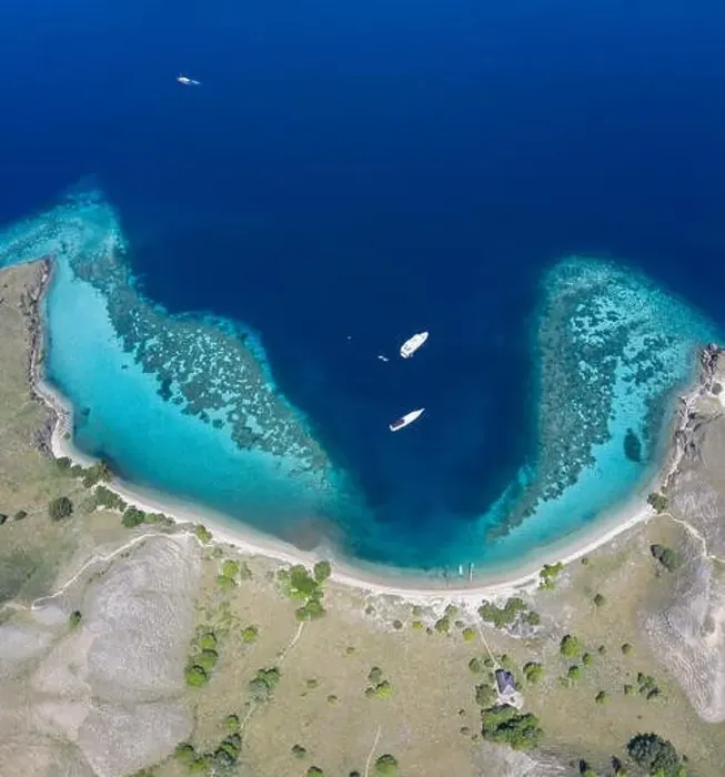 Framed Print : Seen from an aerial view, a healthy coral reef fringes the beautiful island of Gili Darat within Komodo National Park Framed Print : Seen from an aerial view, a healthy coral reef fringes the beautiful island of Gili Darat within Komodo National Park