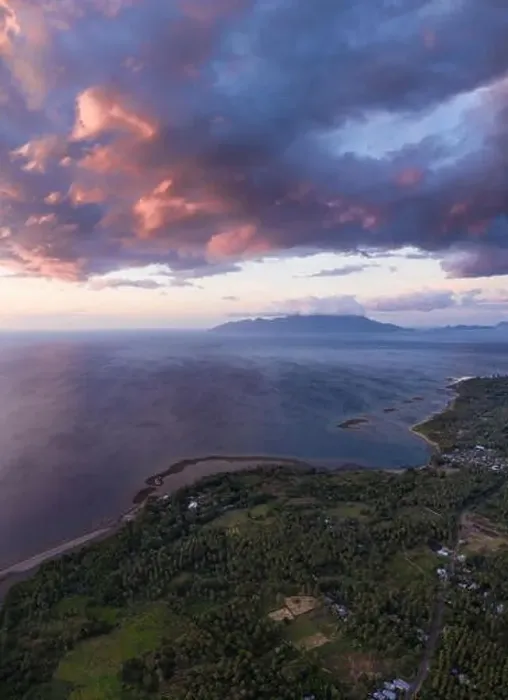 Framed Print : Seen from an aerial view, the tropical island of Flores is illuminated at sunset Framed Print : Seen from an aerial view, the tropical island of Flores is illuminated at sunset