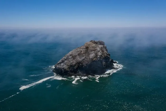 Framed Print : Seen from a bird's eye view, the cold, nutrient-rich waters of the Pacific Ocean wash against the scenic and rugged coastline of Northern California