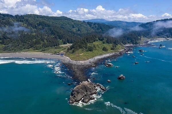 Seen from a bird's eye view, the cold, nutrient-rich waters of the Pacific Ocean wash against the scenic and rugged coastline of Northern California