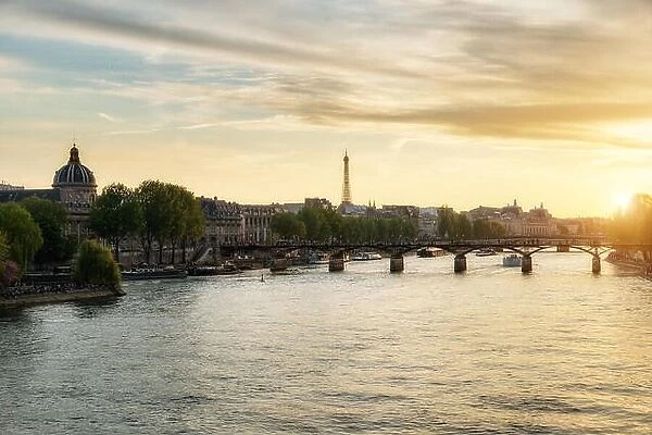 Seine river and Pont des Arts bridge in suset at Paris, France