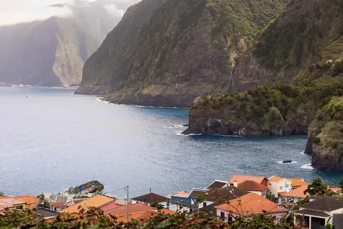 Framed Print : Seixal village and coastline with big cliffs of with the Véu da Noiva waterfall in the background Framed Print : Seixal village and coastline with big cliffs of with the Véu da Noiva waterfall in the background