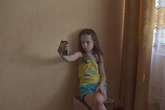 Framed Print : Selfie star. Small girl take selfie with smartphone Framed Print : Selfie star. Small girl take selfie with smartphone