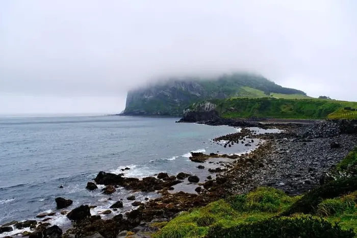 Framed Print : Seongsan Ilchulbong and sea coastline in Jeju Island, south Korea on cloudy day