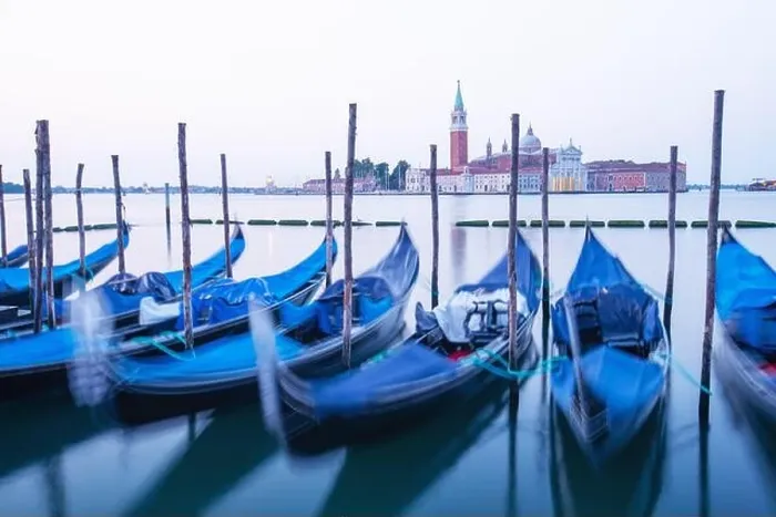 Framed Print : Serene landscape with clear sunrise sky on piazza San Marco in Venice. Row of gondolas parked on city pier Framed Print : Serene landscape with clear sunrise sky on piazza San Marco in Venice. Row of gondolas parked on city pier