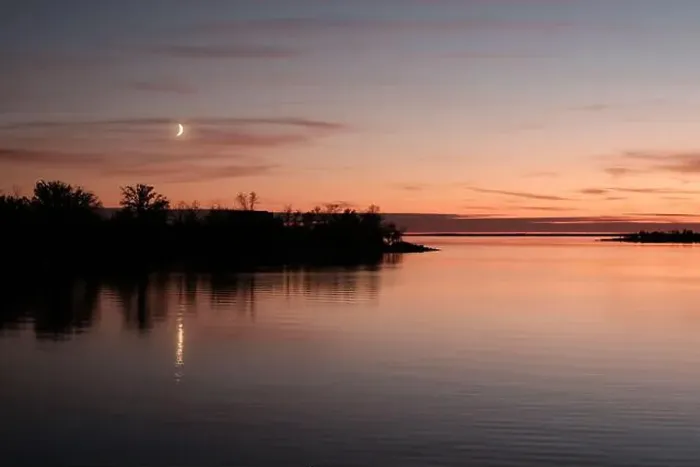 Framed Print : The setting moons magic over Lake Manitoba in Canada