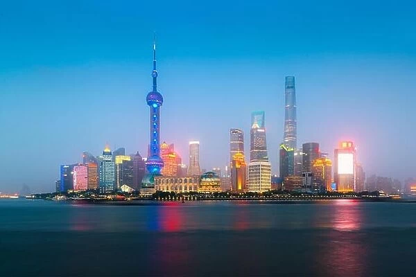 Shanghai, China city skyline at night on the Huangpu River