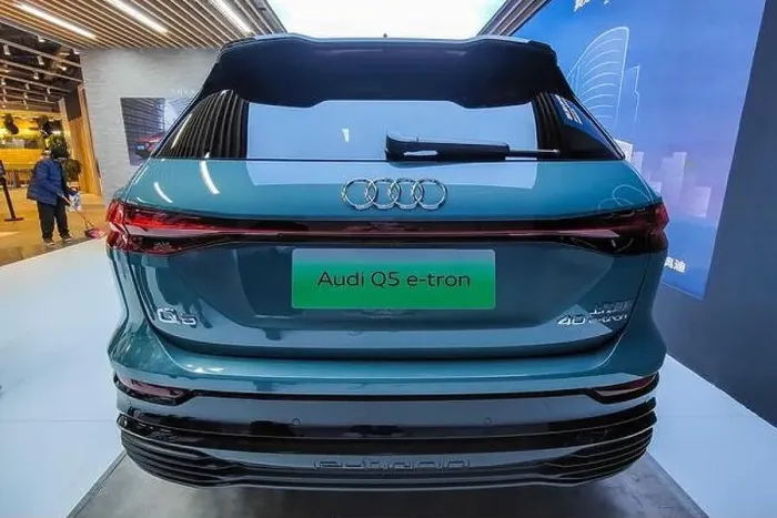 Framed Print : SHANGHAI, CHINA - DECEMBER 31, 2021 - An Audi Q5 E-tron electric vehicle is seen in Shanghai Framed Print : SHANGHAI, CHINA - DECEMBER 31, 2021 - An Audi Q5 E-tron electric vehicle is seen in Shanghai