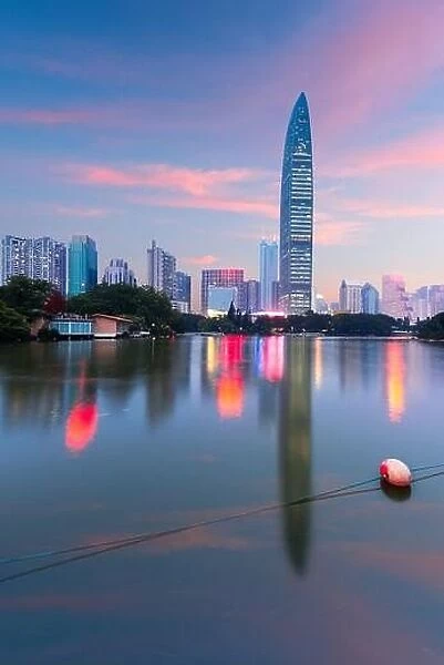 Shenzhen, China city park and skyline and at twilight