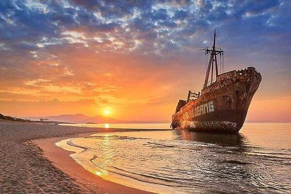 Shipwreck at sunrise, Glyfada Beach near Gytheio, Peloponnese, Greece