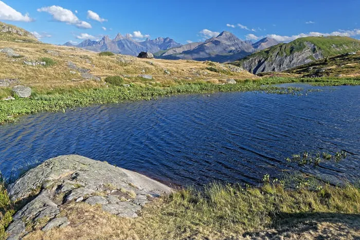 Framed Print : Shore of the Guichard Lake on Col de la Croix de Fer, with Aiguilles d'Arves in the background Framed Print : Shore of the Guichard Lake on Col de la Croix de Fer, with Aiguilles d'Arves in the background