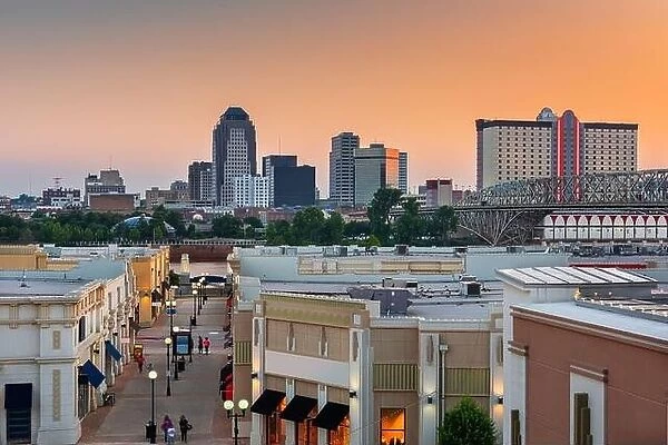 Shreveport, Louisiana, USA downtown city skyline and shopping areas at dusk