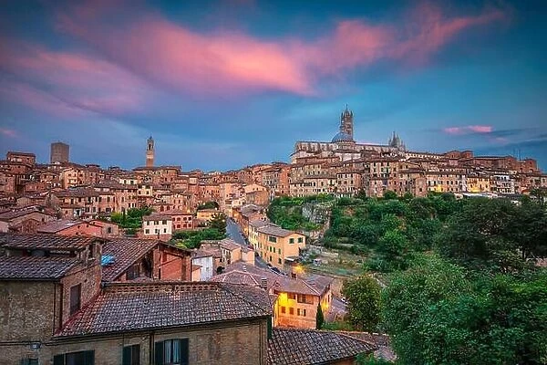 Siena. Cityscape aerial image of medieval city of Siena, Italy during sunset