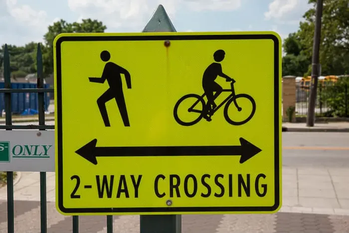 Framed Print : Sign warning of a pedestrian and bicycle crossing