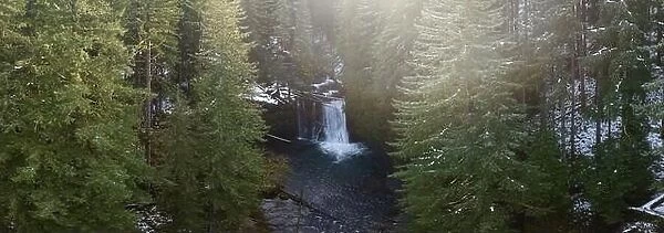 Silver Creek flows over the beautiful Upper North Falls near Silverton, Oregon. This scenic, heavily forested area harbors many impressive waterfalls