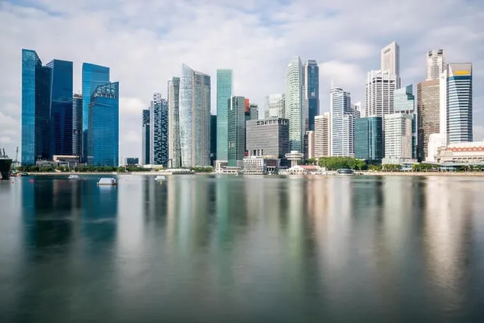 Framed Print : Singapore business district with skyscraper building and reflection at Marina Bay, Singapore Framed Print : Singapore business district with skyscraper building and reflection at Marina Bay, Singapore