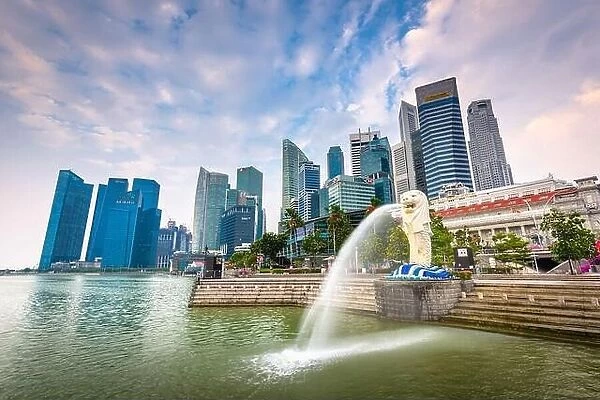 SINGAPORE - SEPTEMBER 3, 2015: The Merlion statue fountain and the Singapore skyline. The landmark statue is considered the personification of Singapo
