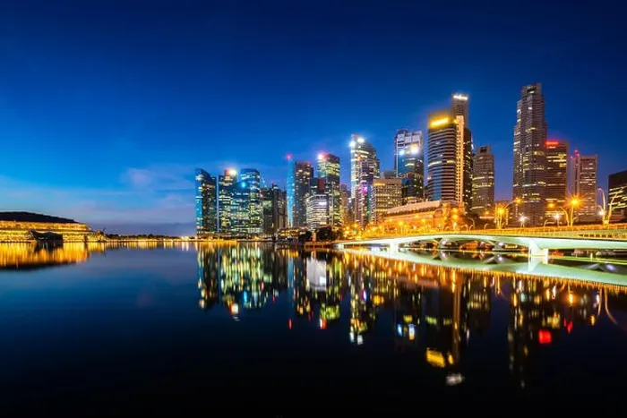 Framed Print : Singapore skyscraper building in downtown district with water reflection at Marina Bay in night, Singapore Framed Print : Singapore skyscraper building in downtown district with water reflection at Marina Bay in night, Singapore