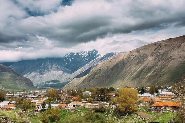 Sioni Village On Mountain Background In Kazbegi District, Mtskheta-Mtianeti Region, Georgia. Spring Or Summer Season