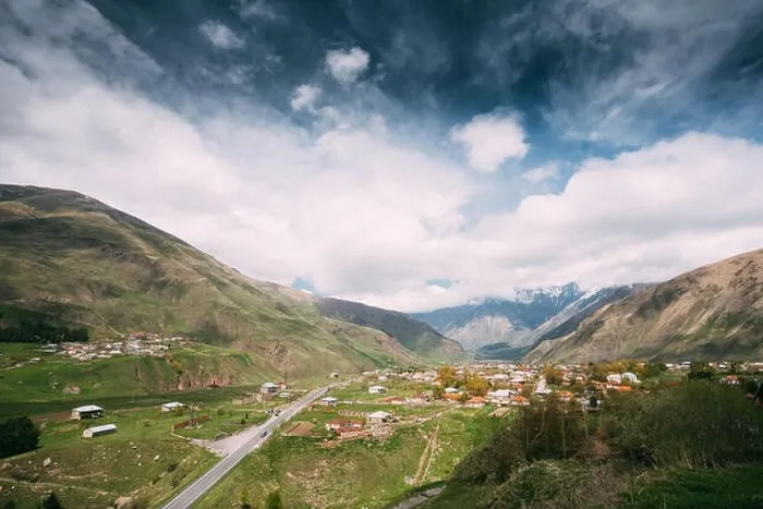 Framed Print : Sioni Village On Mountain Background In Kazbegi District, Mtskheta-Mtianeti Region, Georgia. Spring Or Summer Season Framed Print : Sioni Village On Mountain Background In Kazbegi District, Mtskheta-Mtianeti Region, Georgia. Spring Or Summer Season