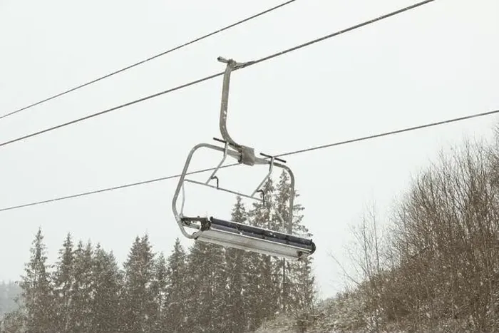 Framed Print : Empty ski lift in snowy day in Carpathians Framed Print : Empty ski lift in snowy day in Carpathians