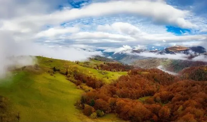 Framed Print : Sky with white and fluffy layer of clouds over green autumn hills, Aerial panoramic drone shot Framed Print : Sky with white and fluffy layer of clouds over green autumn hills, Aerial panoramic drone shot