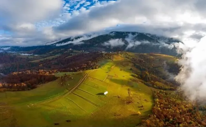 Framed Print : Sky with white and fluffy layer of clouds over green autumn hills, Aerial panoramic drone shot Framed Print : Sky with white and fluffy layer of clouds over green autumn hills, Aerial panoramic drone shot