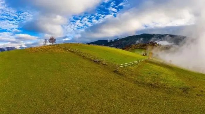 Framed Print : Sky with white and fluffy layer of clouds over green autumn hills, Aerial panoramic drone shot Framed Print : Sky with white and fluffy layer of clouds over green autumn hills, Aerial panoramic drone shot