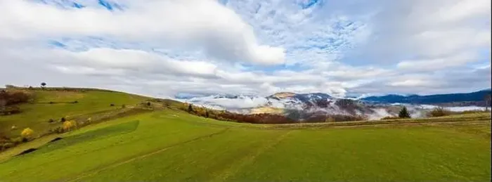Framed Print : Sky with white and fluffy layer of clouds over green autumn hills, Aerial panoramic drone shot Framed Print : Sky with white and fluffy layer of clouds over green autumn hills, Aerial panoramic drone shot