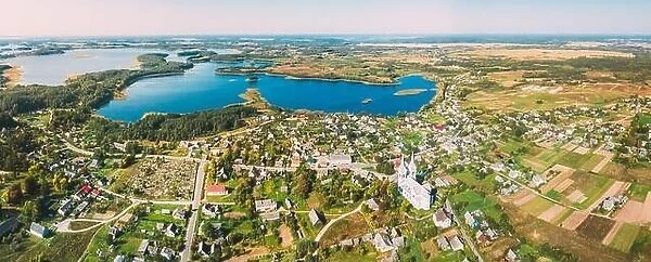 Slobodka, Braslaw District, Vitebsk Voblast, Belarus. Aerial View Of Potsekh Lake Near Slobodka Village. Church of Divine Providence. Panorama