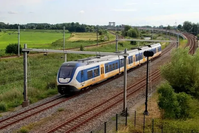 Framed Print : SLT sprinter local commuter train on track in Moordrecht in the Netherlands Framed Print : SLT sprinter local commuter train on track in Moordrecht in the Netherlands