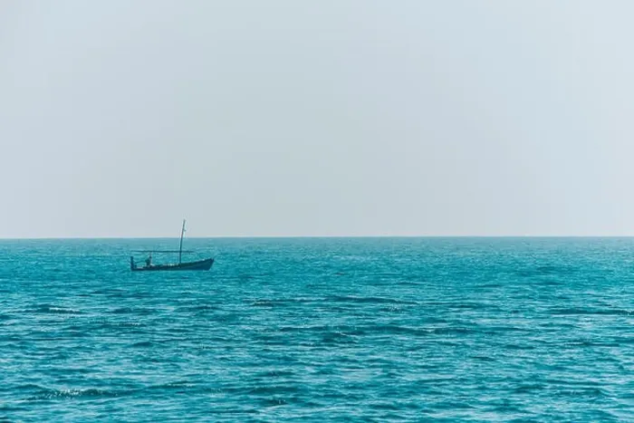 Framed Print : Small boat fishing in endless ocean water Framed Print : Small boat fishing in endless ocean water